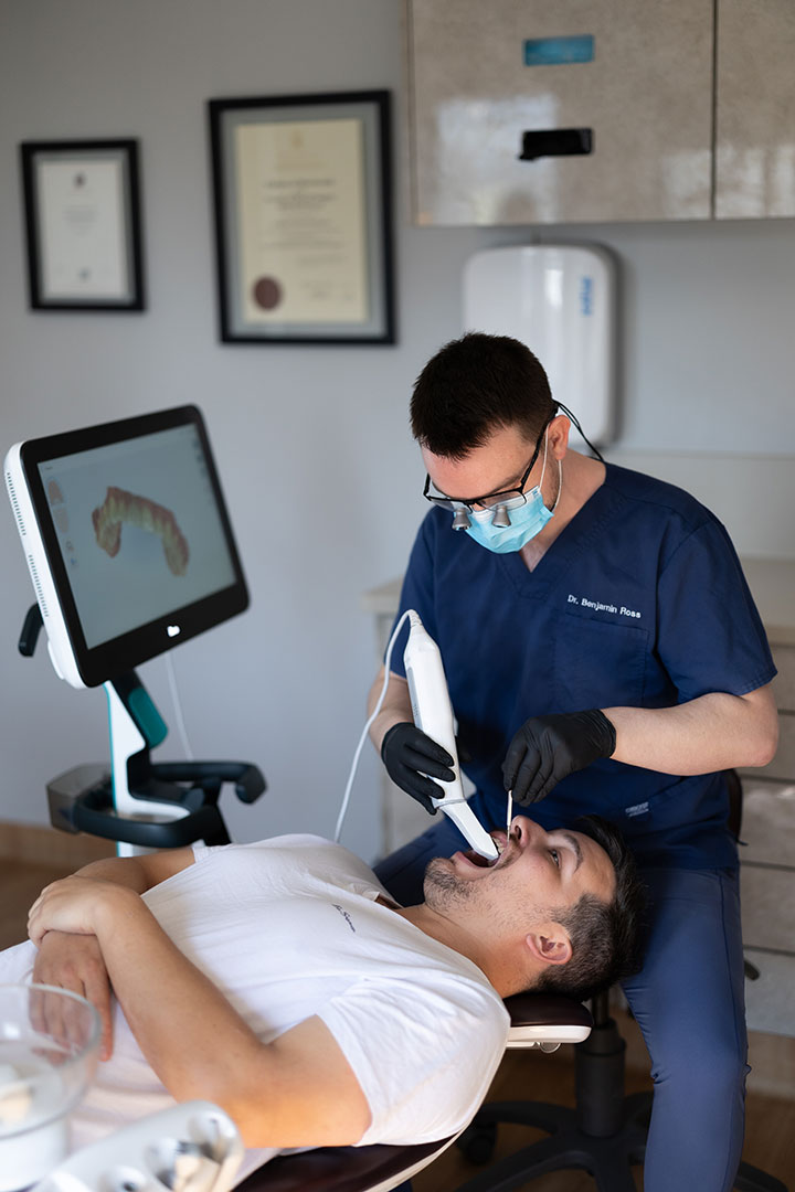Dr-Benjamin-using-intra-oral-device